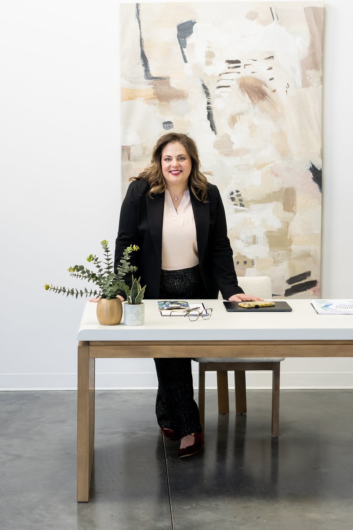 Anne-Mari Seberger standing at her desk